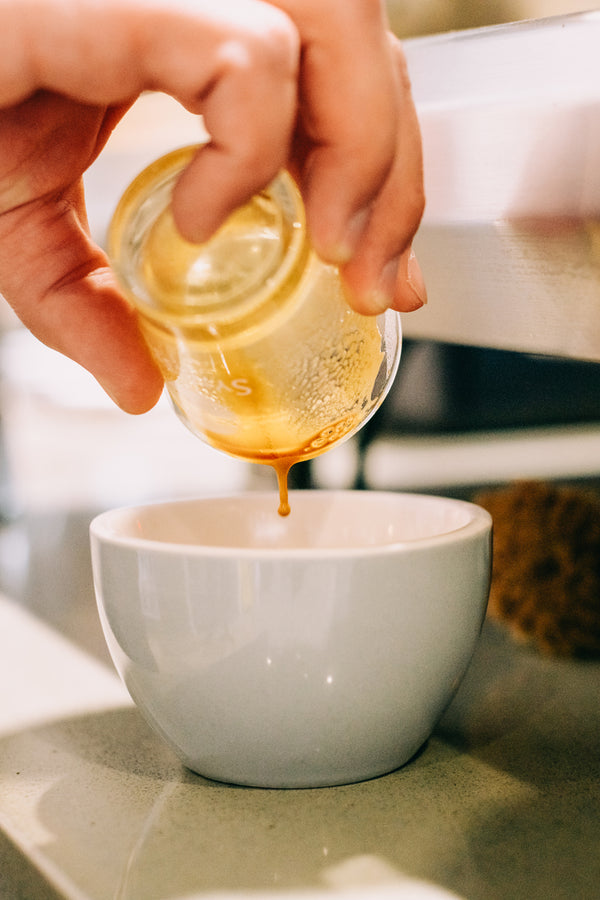 Picture of an espresso shot being poured into a mug.