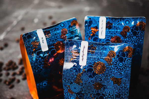 Three bags of Copper Door Coffee Roaster's coffee bean subscription 