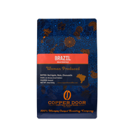 Front view of Copper Door Coffee Roasters Brazil coffee beans with tasting notes of Red Apple, Nuts, and Chamomile.