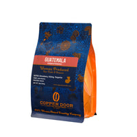 Guatemala Huehuetenango Coffee Beans by Copper Door Coffee Roasters. Woman produced beans with tasting notes of Strawberry, Oolong and Tangerine