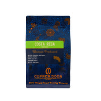 Front view of a bag of Copper Door Coffee Roasters Costa Rica Roast with tasting notes of Pistachio, Red Apple & Graham Cracker