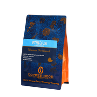 Side view of Ethiopia Yirgacheffe Roast Coffee Beans with notes of Mixed Berry, Lemon, Brulee