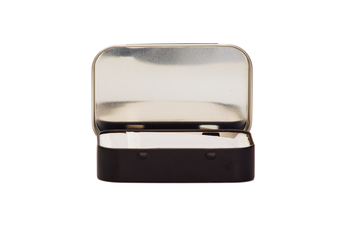 Open, front view of Four Sisters Espresso Instant Coffee Tin with notes of Chocolate Ganache, Caramel, & Key lime