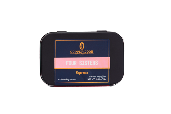 Front view of Copper Door Coffee Roaster's Four Sisters Espresso Instant Coffee Tin