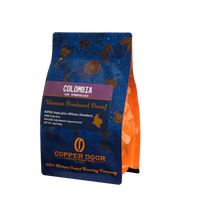 Angled view of Copper Door Coffee Roasters Colombia Decaf Coffee with tasting notes of Grape Juice, Hibiscus & strawberry