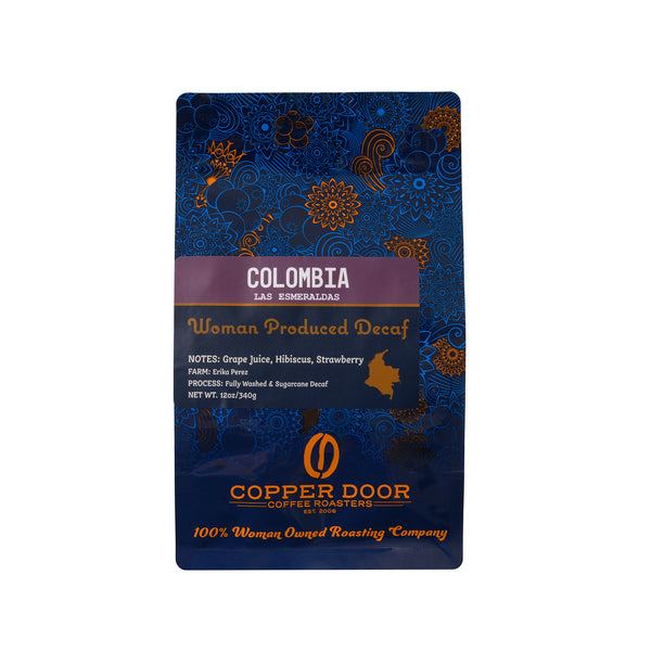 Front view of Copper Door Coffee Roasters Colombia Decaf Coffee with tasting notes of Grape Juice, Hibiscus & strawberry