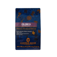 Front view of Colombia Decaf Coffee Beans with tasting notes of Grape Juice, Hibiscus & strawberry.