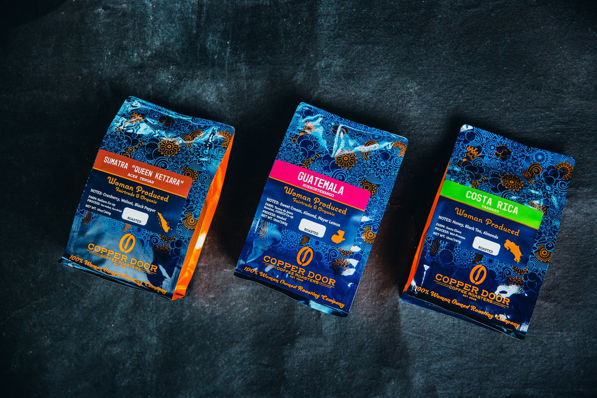 Three bags of Copper Door Coffee Roaster's coffee beans: Sumatra, Guatemala, and Costa Rica