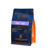 Angled view of Shady Lady Coffee Blend with tasting notes of Mixed Berry, Lemon Zest, and Black Cherry