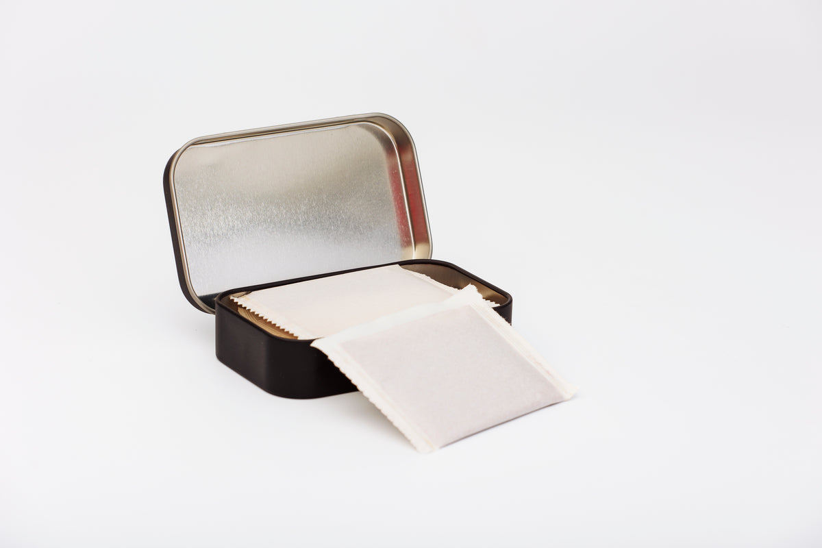 Open, side view of Four Sisters Espresso Instant Coffee Tin with notes of Chocolate Ganache, Caramel, & Key lime